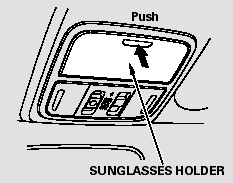To open the sunglasses holder, push